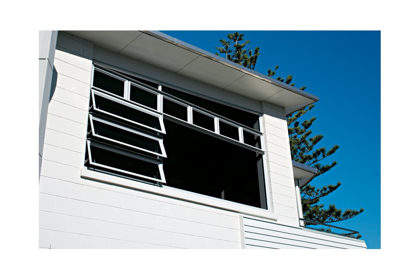Raked windows maintain the line of the home